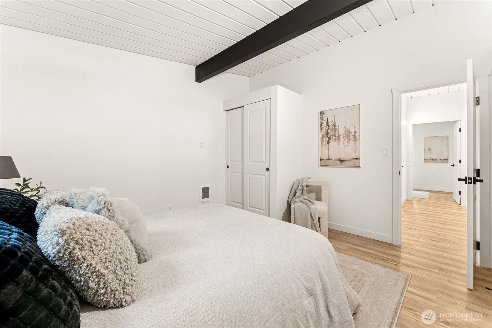 6198 Clover Valley Road Southeast Port Orchard, WA 98367 - Photo 14 of 34 a bedroom with a bed and a mirror