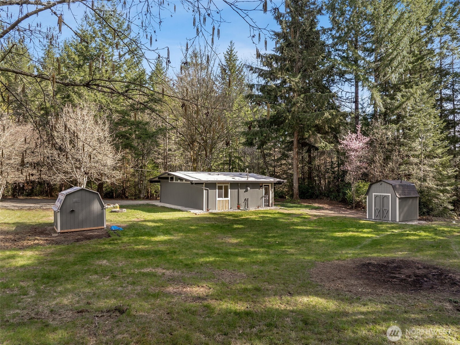 6198 Clover Valley Road Southeast Port Orchard, WA 98367 - Photo 23 of 34 a swimming pool with outdoor seating and yard
