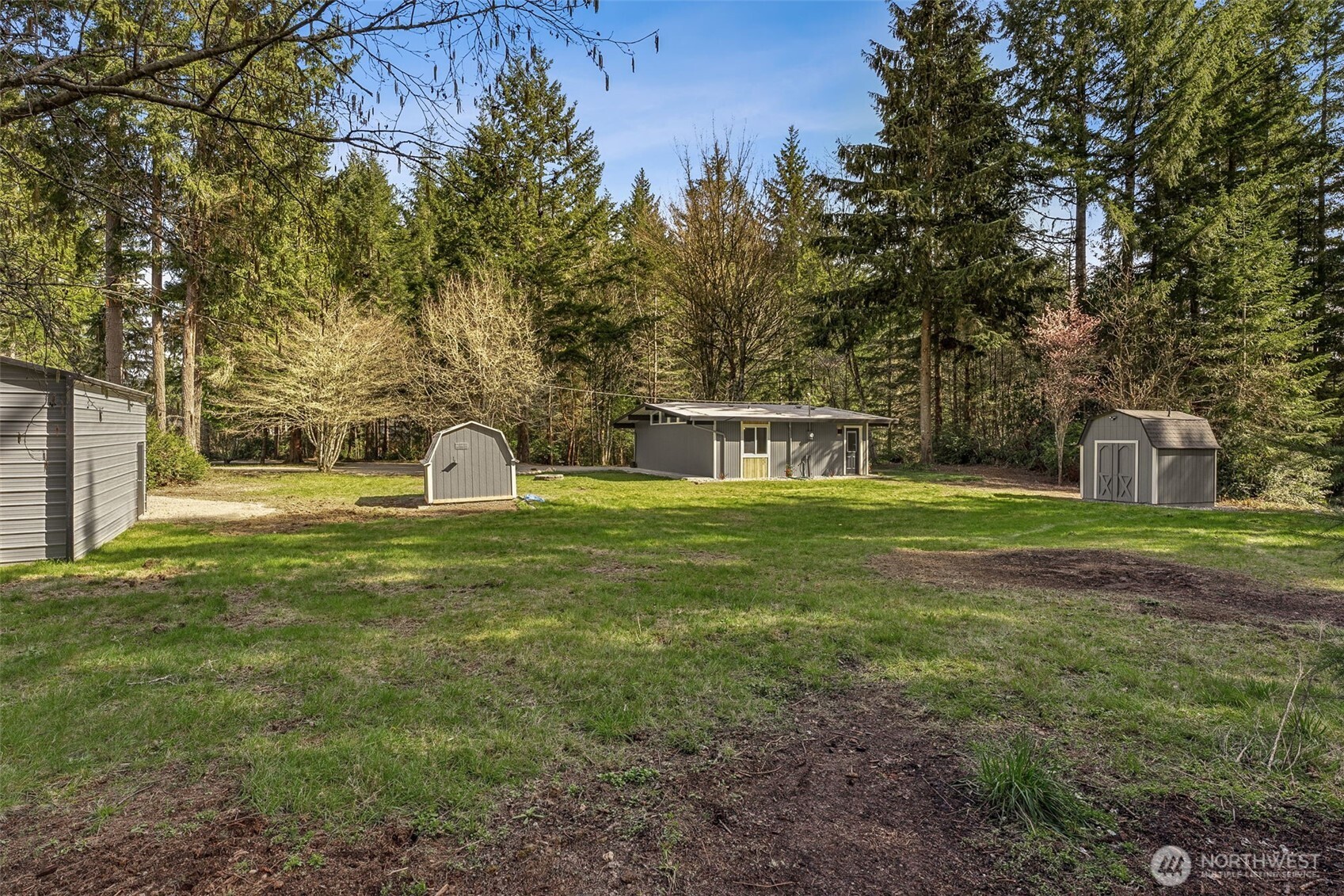 6198 Clover Valley Road Southeast Port Orchard, WA 98367 - Photo 24 of 34 a front view of a house with a yard