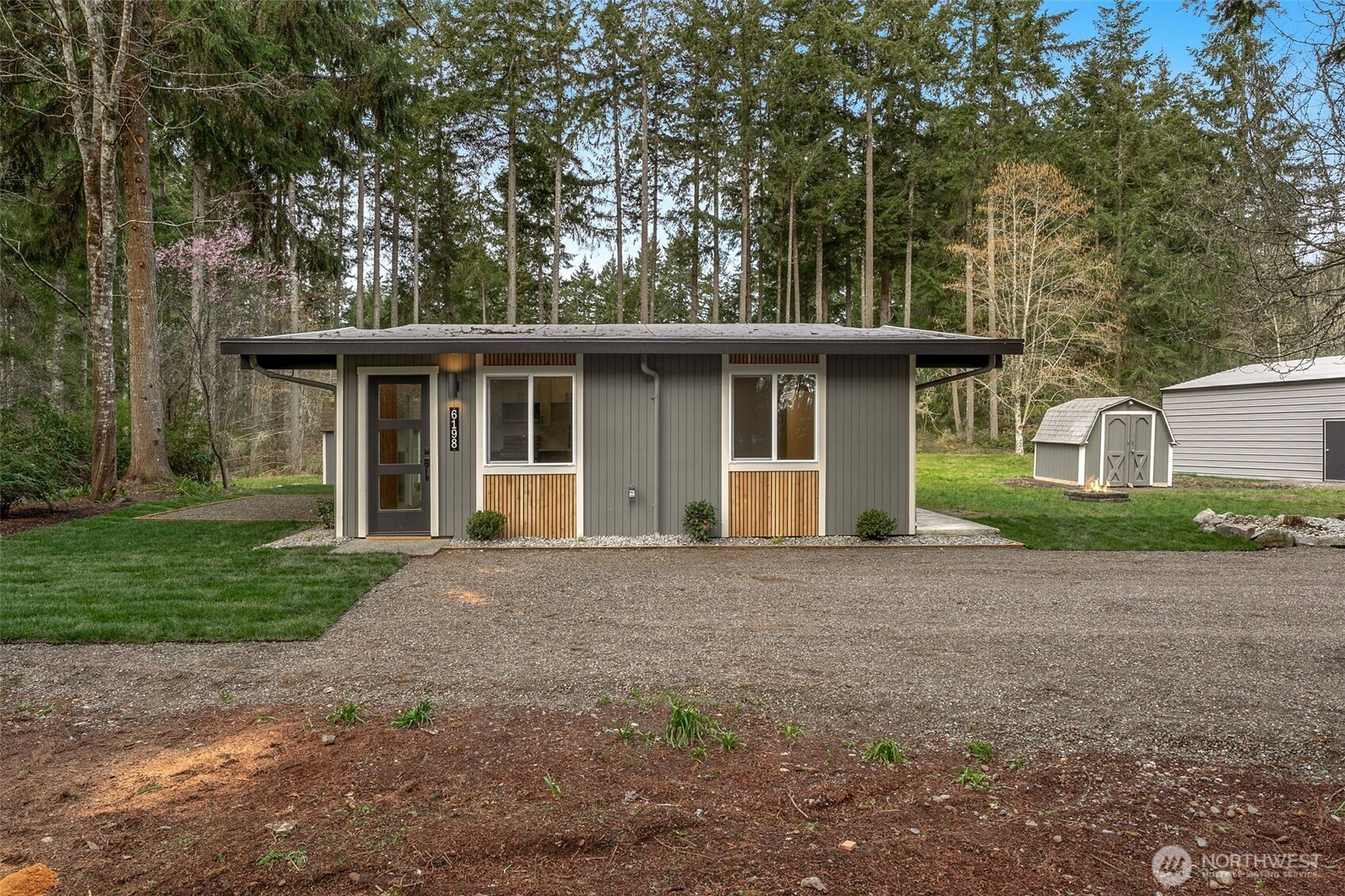 6198 Clover Valley Road Southeast Port Orchard, WA 98367 - Photo 27 of 34 front view of a house with a yard