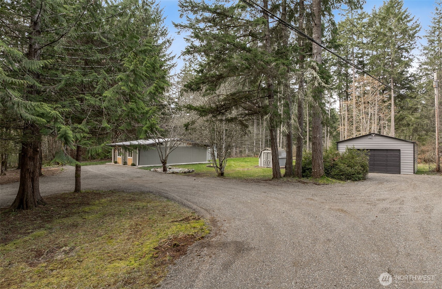 6198 Clover Valley Road Southeast Port Orchard, WA 98367 - Photo 33 of 34 a view of a house with a backyard