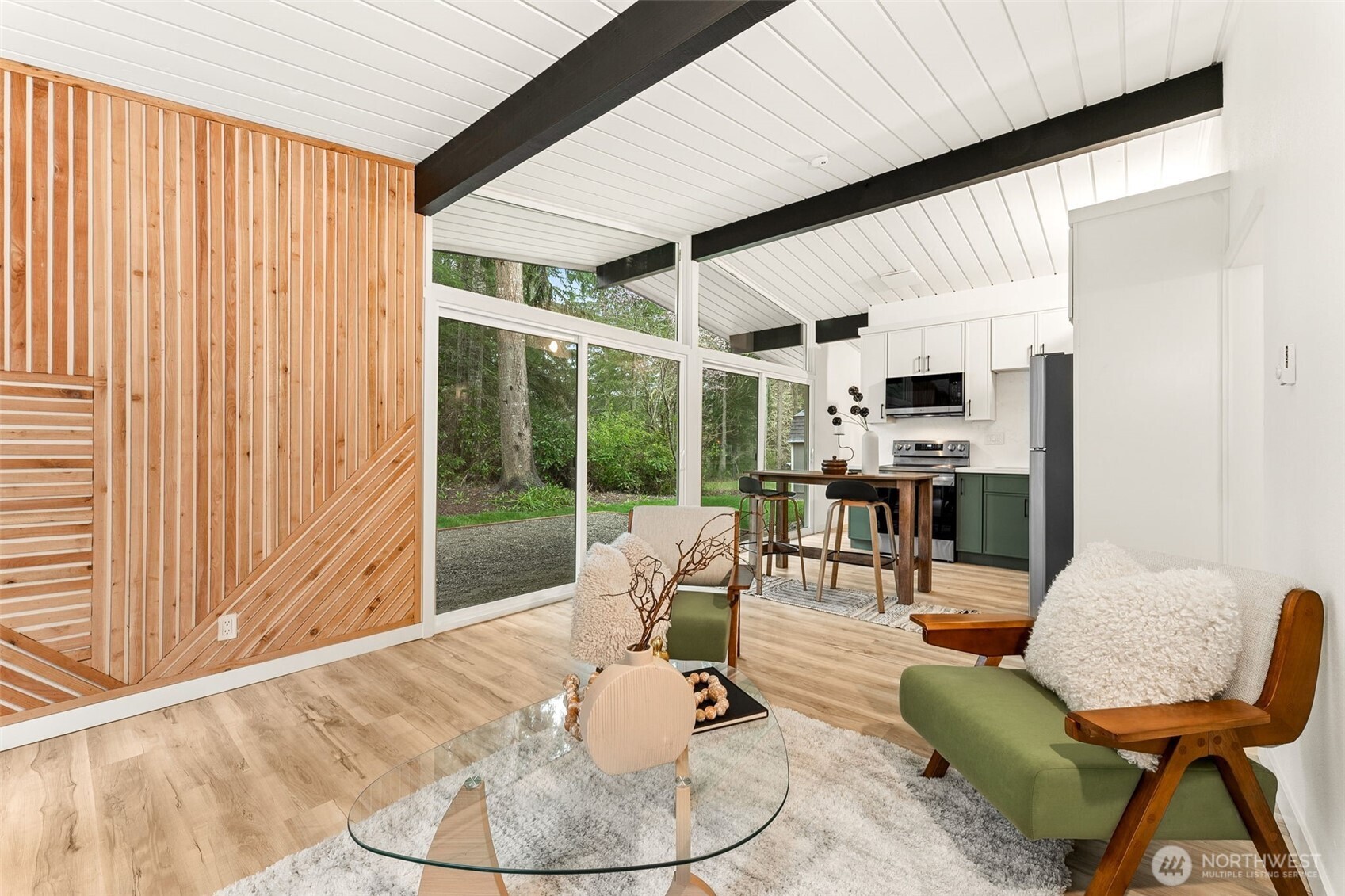 6198 Clover Valley Road Southeast Port Orchard, WA 98367 - Photo 5 of 34 a living room with furniture a floor to ceiling window and kitchen view