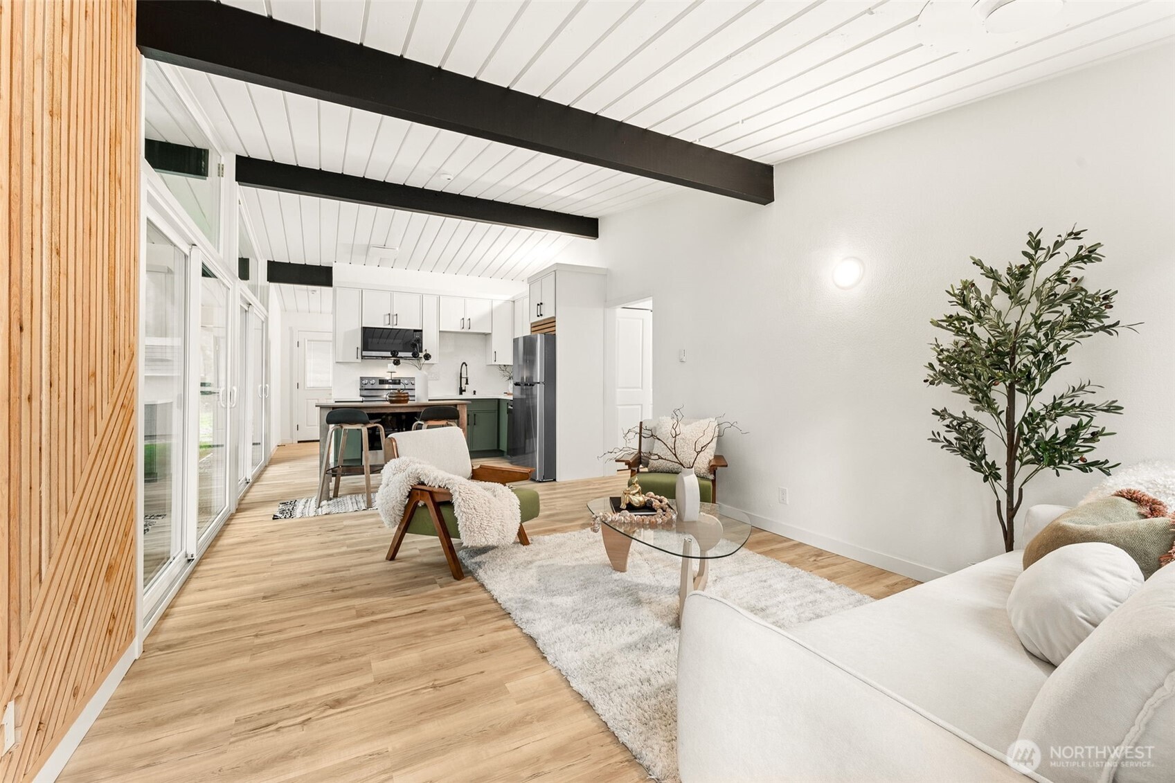 6198 Clover Valley Road Southeast Port Orchard, WA 98367 - Photo 6 of 34 a living room with furniture potted plant and a table