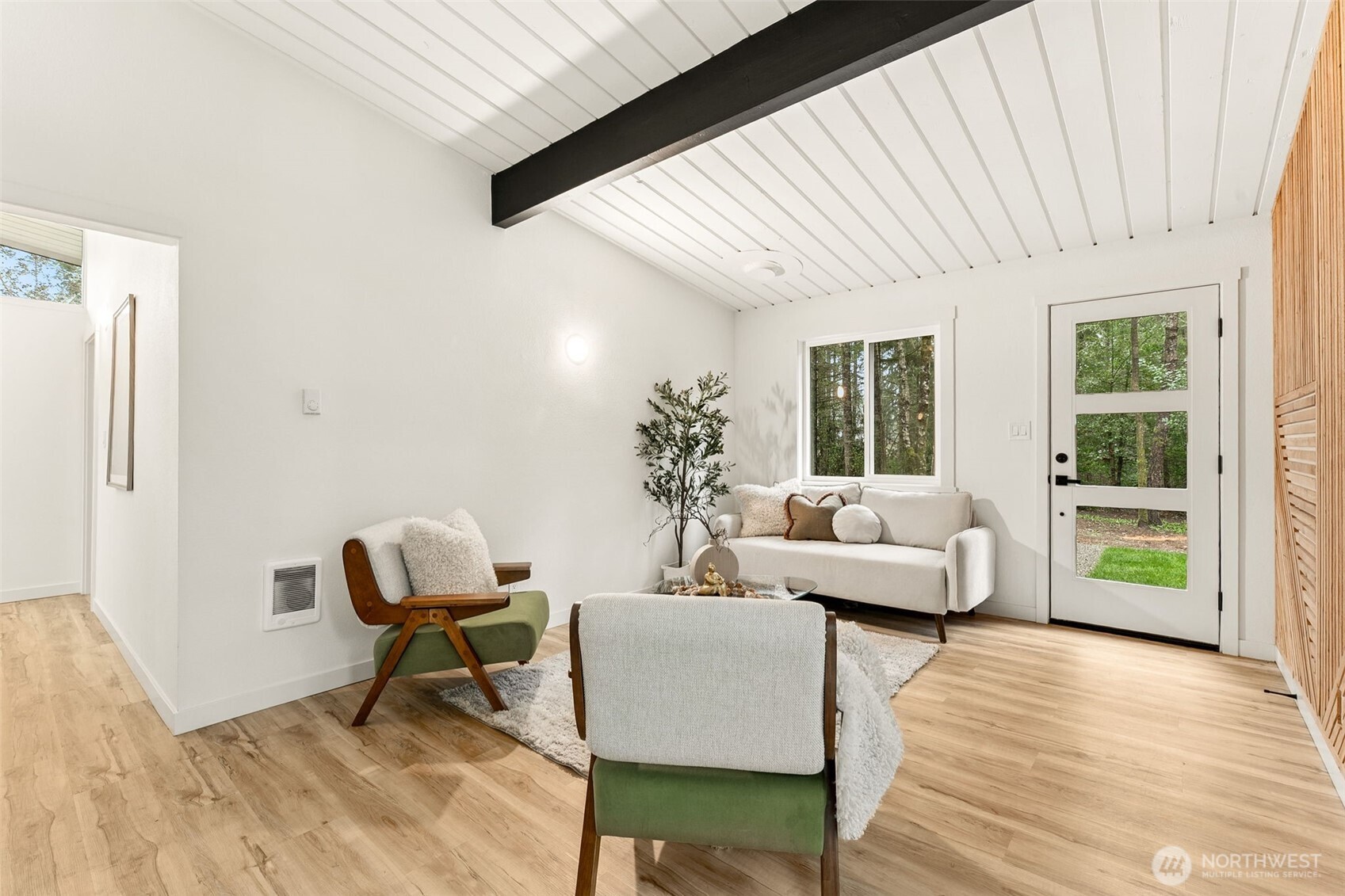 6198 Clover Valley Road Southeast Port Orchard, WA 98367 - Photo 8 of 34 a living room with furniture and a wooden floor