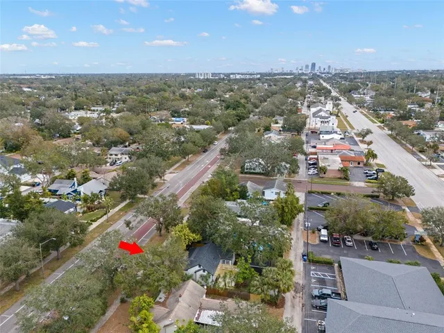 an aerial view of residential building and car parked