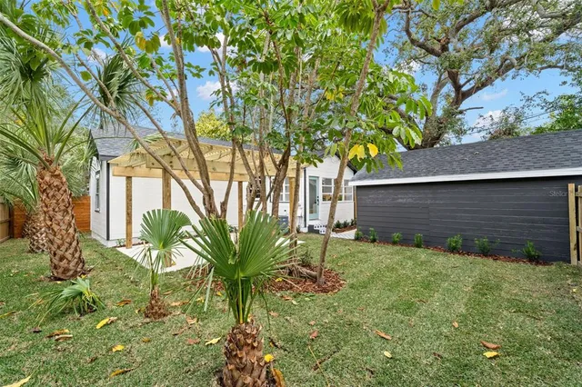 a backyard of a house with lots of green space