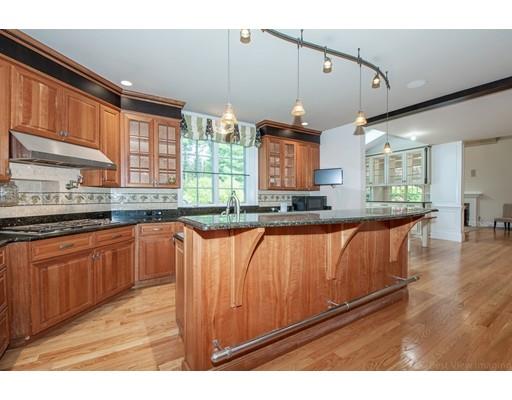 3 Valley Road Dover, MA 02030 - Photo 11 of 30 a kitchen with stainless steel appliances granite countertop a sink a stove cabinets counter space and a window