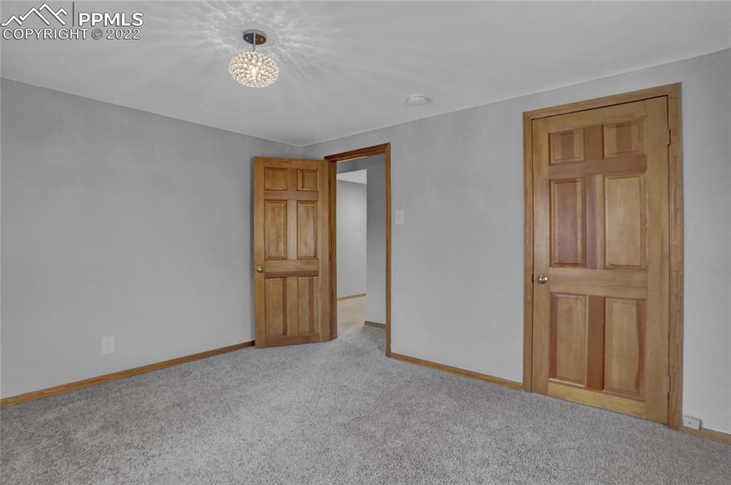 1024 Prairie Road Colorado Springs, CO 80909 - Photo 14 of 22 a view of an empty room and closet area