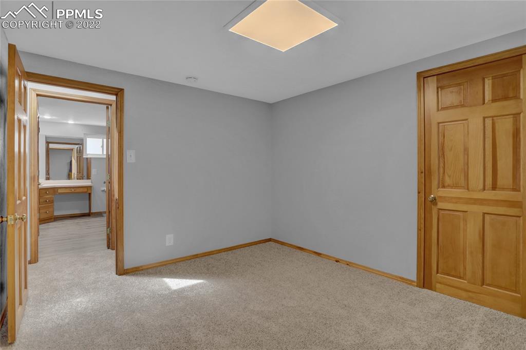 1024 Prairie Road Colorado Springs, CO 80909 - Photo 16 of 22 an empty room with windows