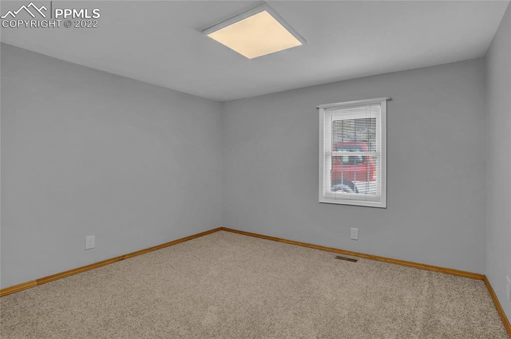 1024 Prairie Road Colorado Springs, CO 80909 - Photo 17 of 22 an empty room with a window