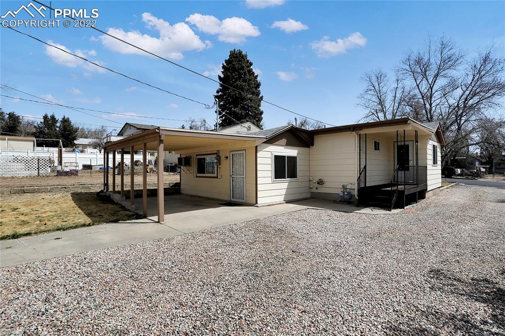 1024 Prairie Road Colorado Springs, CO 80909 - Photo 3 of 22 a view of a house with a snow