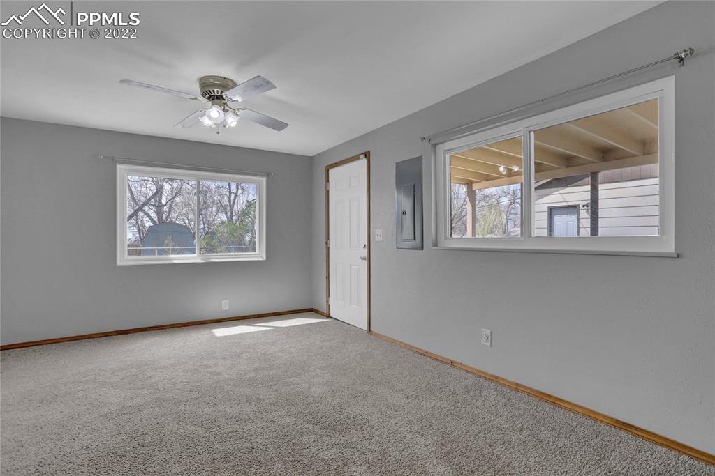 1024 Prairie Road Colorado Springs, CO 80909 - Photo 10 of 22 an empty room with windows