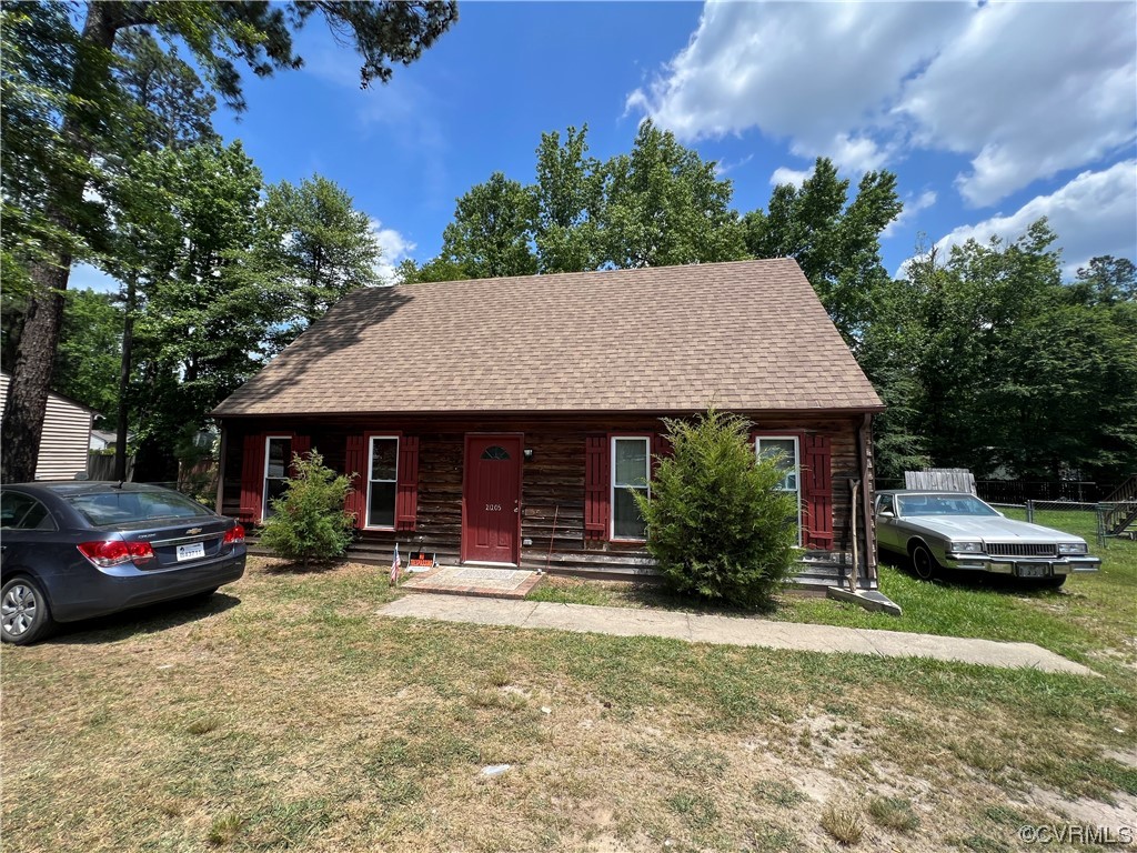 21205 Matoaca Road Petersburg, VA 23803 - Photo 2 of 10 a front view of a house with garden