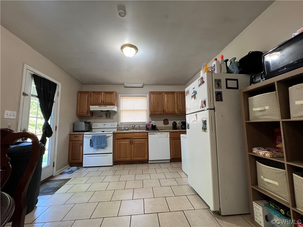 21205 Matoaca Road Petersburg, VA 23803 - Photo 5 of 10 a kitchen with stainless steel appliances granite countertop a refrigerator and a stove top oven
