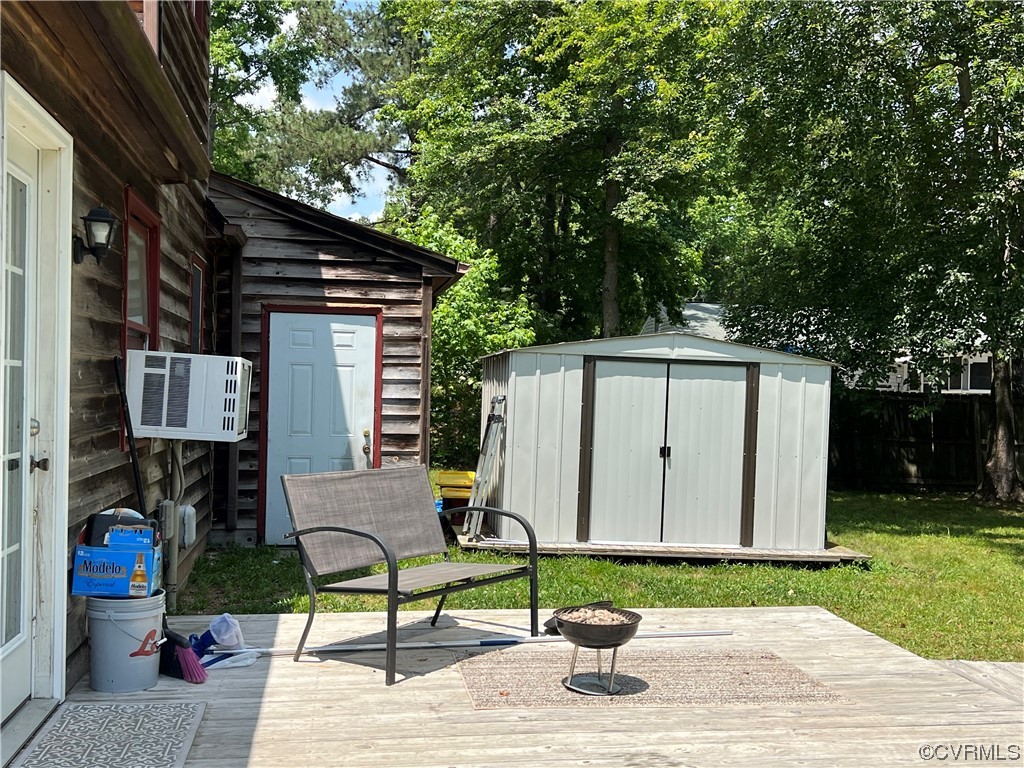 21205 Matoaca Road Petersburg, VA 23803 - Photo 8 of 10 a view of backyard with a barn and a cactus plant