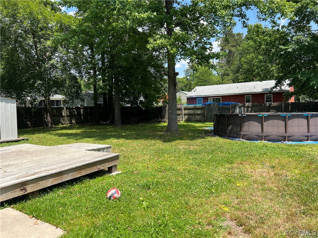 21205 Matoaca Road Petersburg, VA 23803 - Photo 10 of 10 a view of backyard with swimming pool and seating space