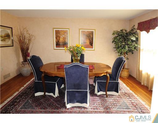 7 Doyle Road Old Bridge, NJ 07747 - Photo 6 of 10 a view of a dining room with furniture and wooden floor
