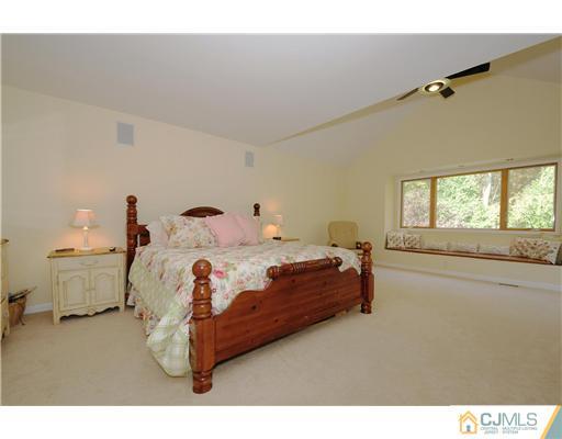 7 Doyle Road Old Bridge, NJ 07747 - Photo 8 of 10 a bedroom with a bed and window
