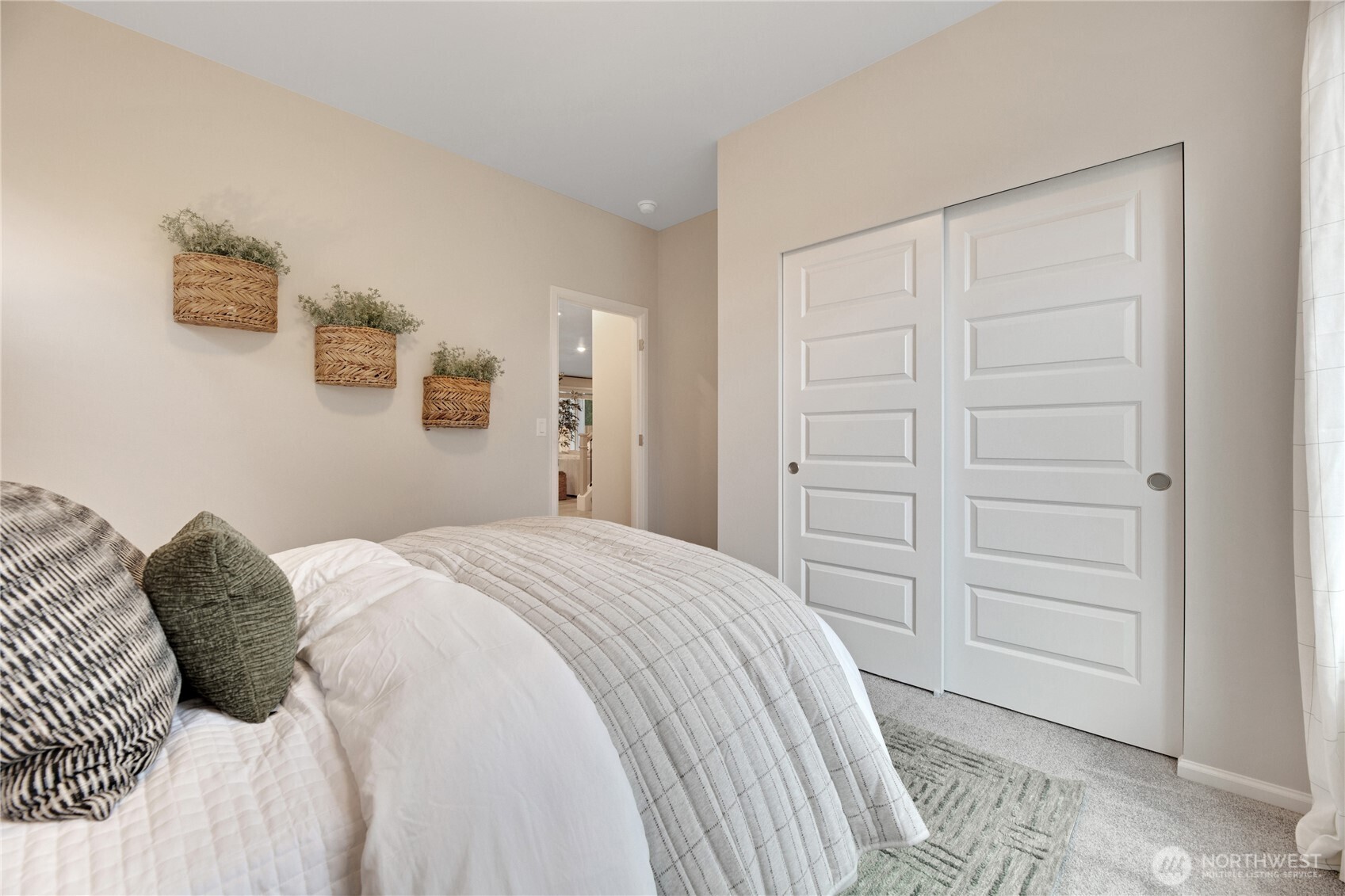 13627 60th Avenue West Edmonds, WA 98026 - Photo 11 of 29 a bedroom with a bed and a walk in closet