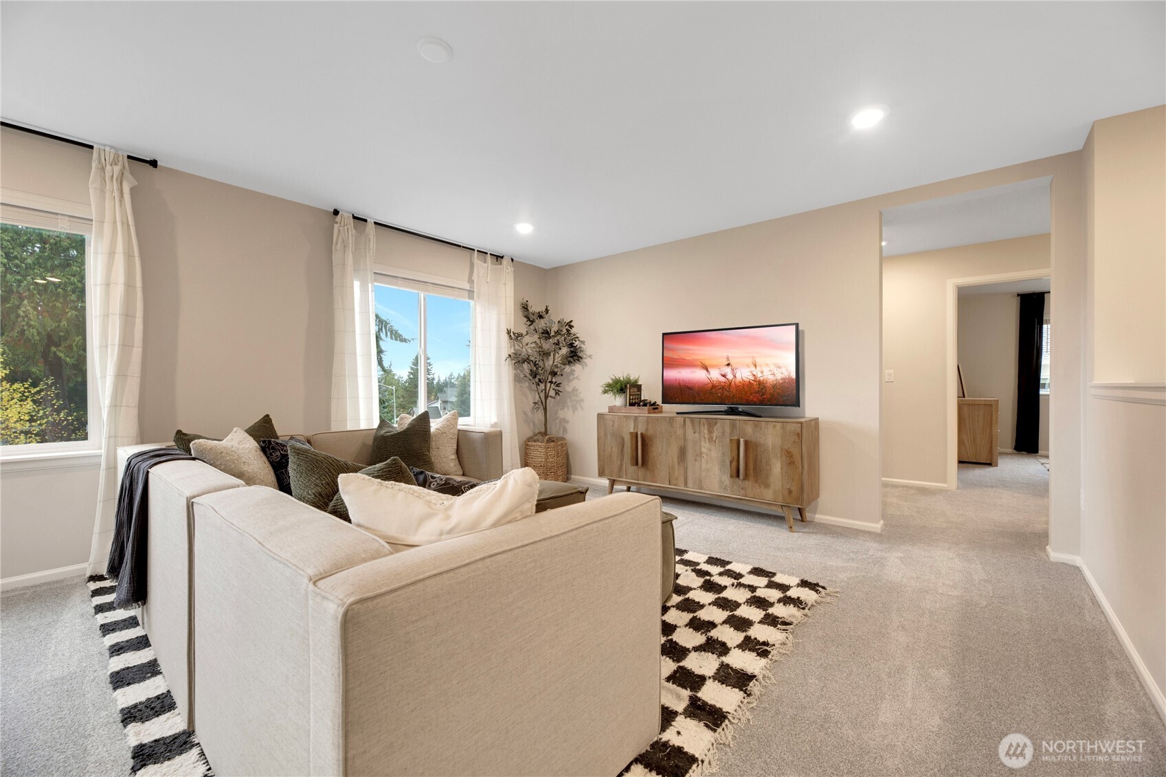 13627 60th Avenue West Edmonds, WA 98026 - Photo 15 of 29 a living room with furniture and a flat screen tv