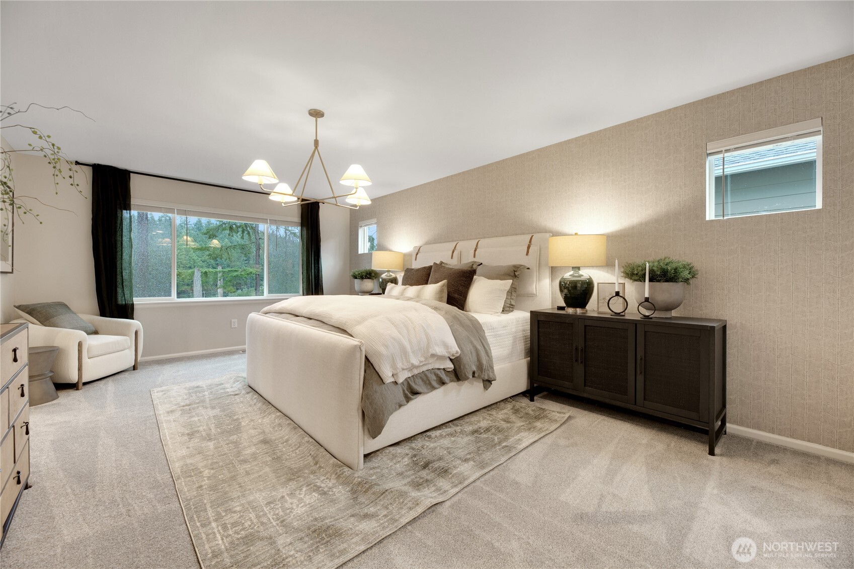 13627 60th Avenue West Edmonds, WA 98026 - Photo 17 of 29 a bedroom with a large bed and a chandelier