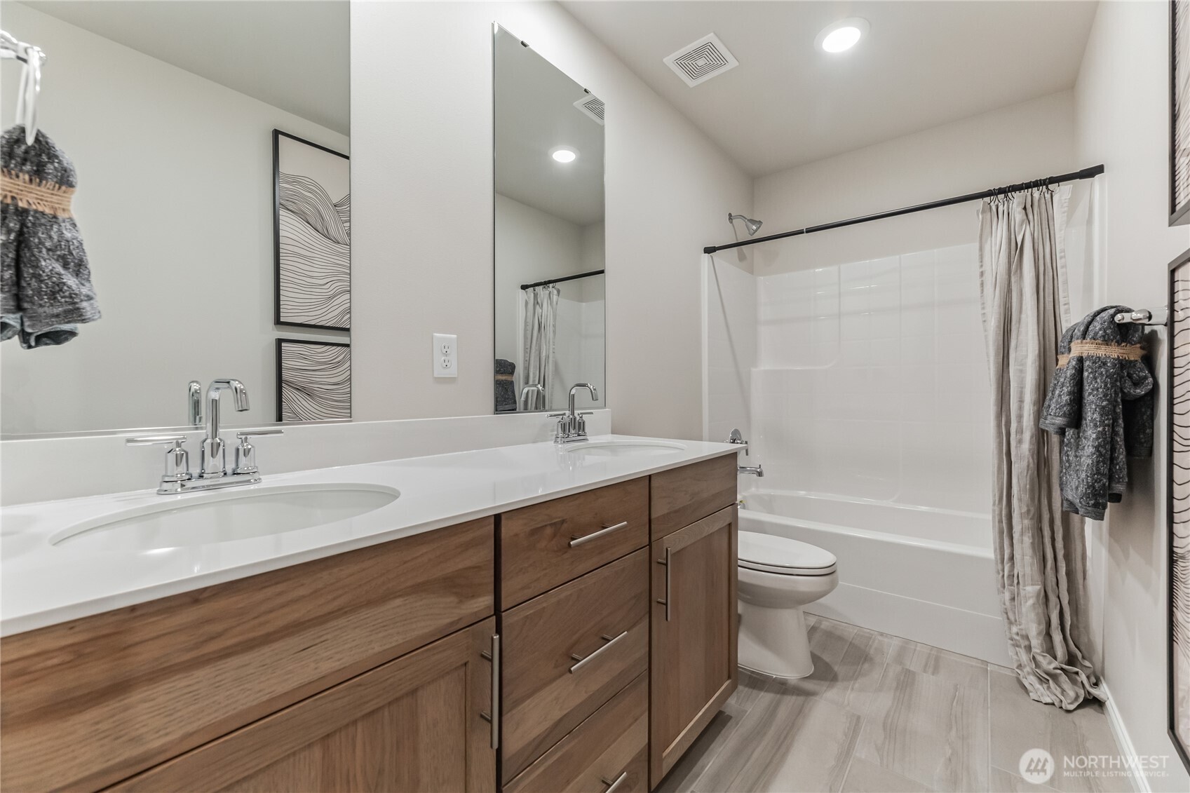 13627 60th Avenue West Edmonds, WA 98026 - Photo 24 of 29 a bathroom with a double vanity sink toilet mirror and shower