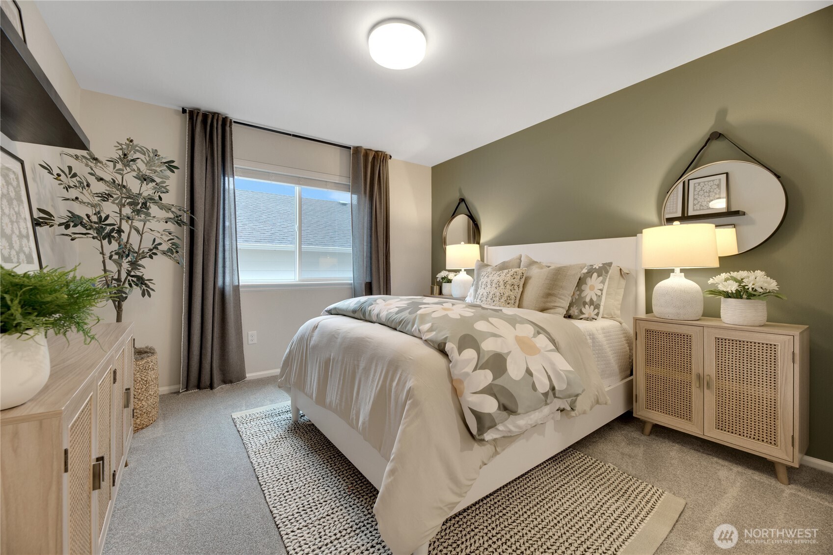 13627 60th Avenue West Edmonds, WA 98026 - Photo 25 of 29 a bedroom with a bed lamp and a potted plant