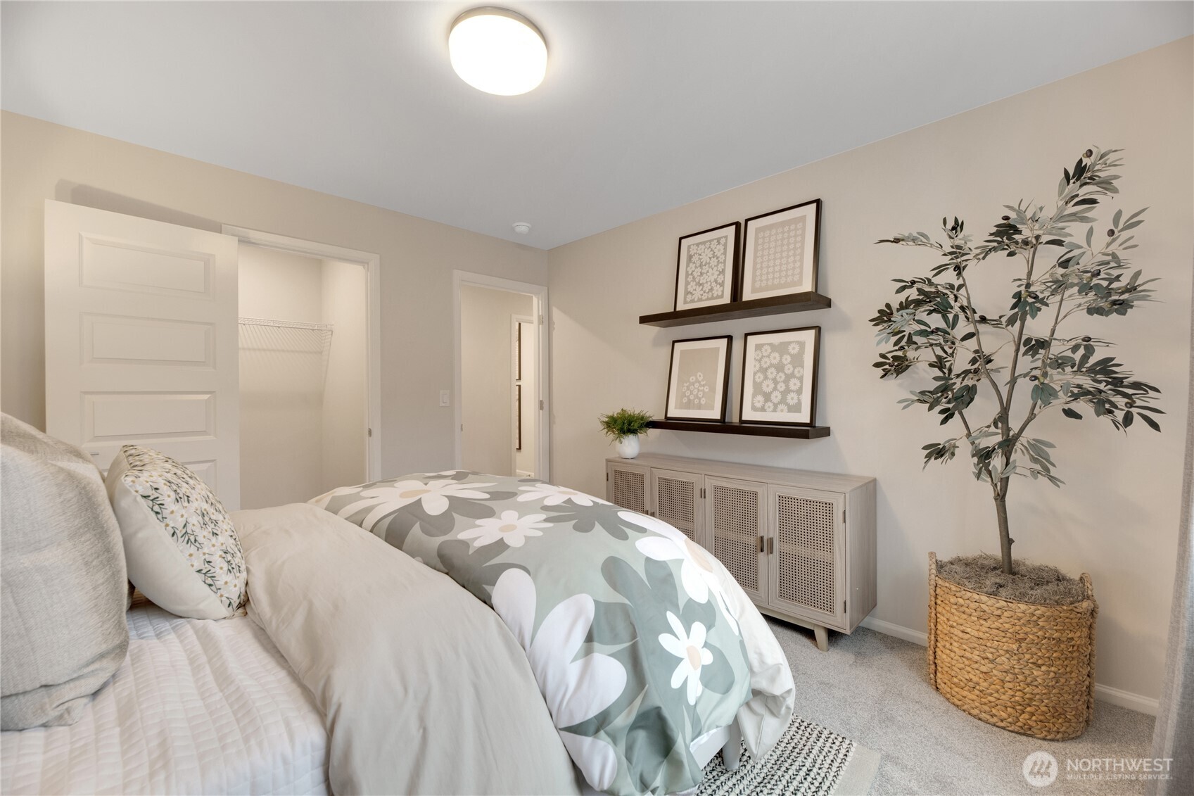 13627 60th Avenue West Edmonds, WA 98026 - Photo 26 of 29 a bedroom with a bed and a potted plant