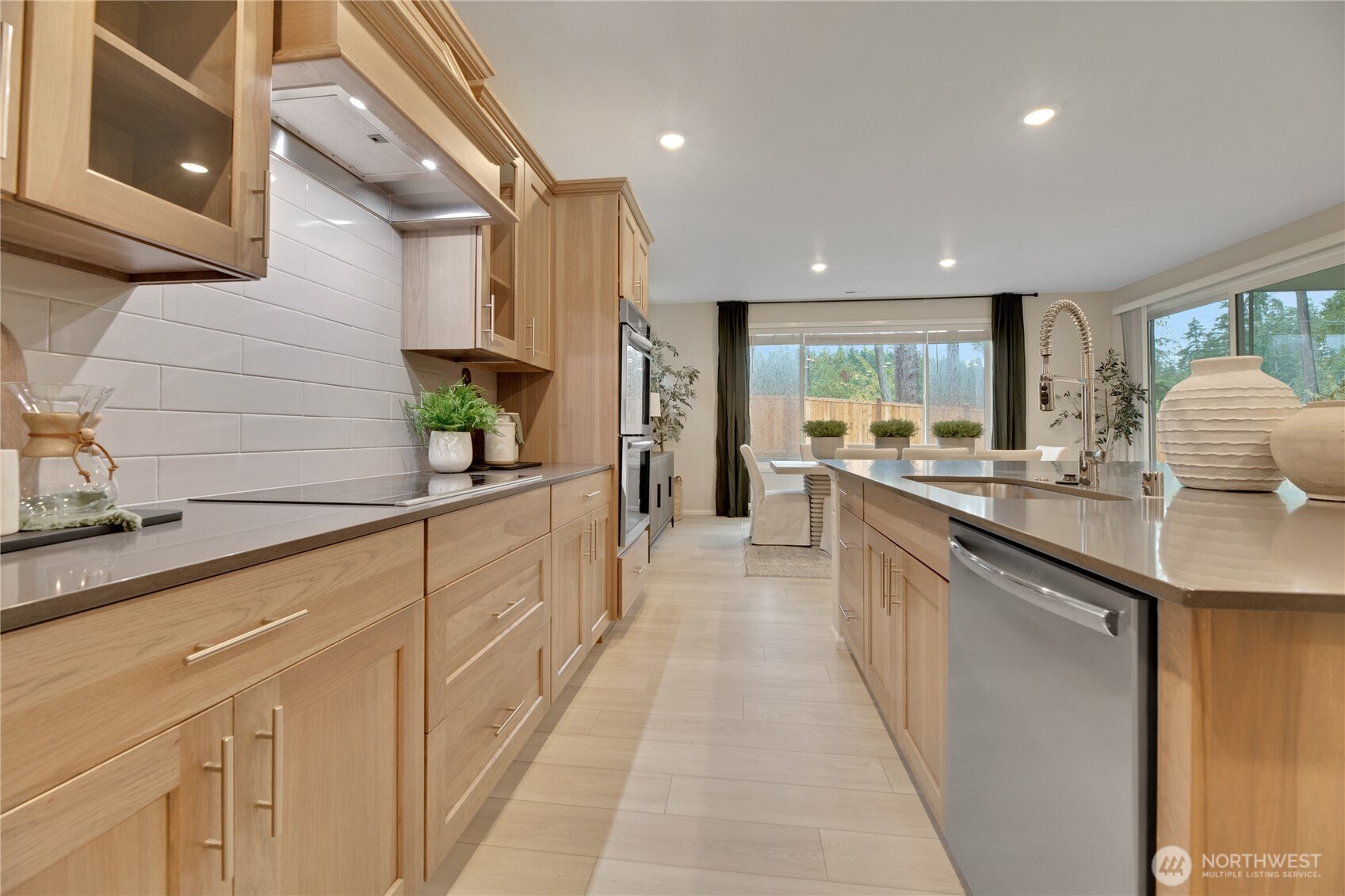 13627 60th Avenue West Edmonds, WA 98026 - Photo 4 of 29 a kitchen with stainless steel appliances a sink stove and cabinets