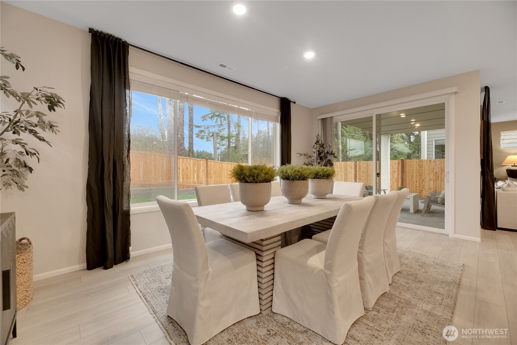 13627 60th Avenue West Edmonds, WA 98026 - Photo 6 of 29 a dining room with furniture and large windows