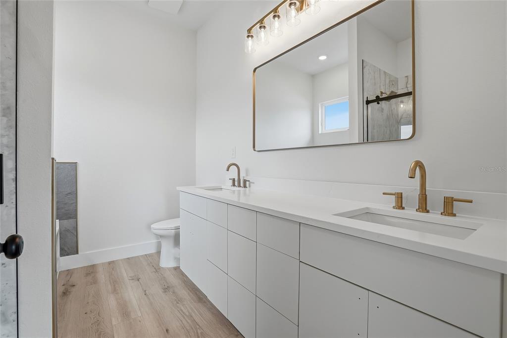 11256 Salters Street Spring Hill, FL 34609 - Photo 20 of 46 a bathroom with a sink and a toilet