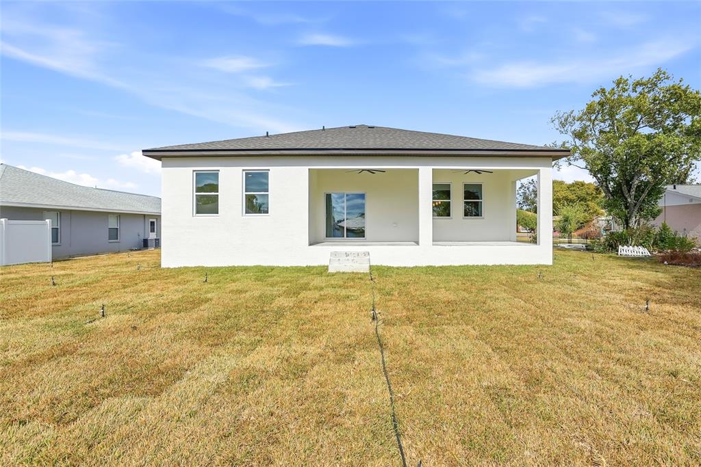 11256 Salters Street Spring Hill, FL 34609 - Photo 35 of 46 a front view of house with yard
