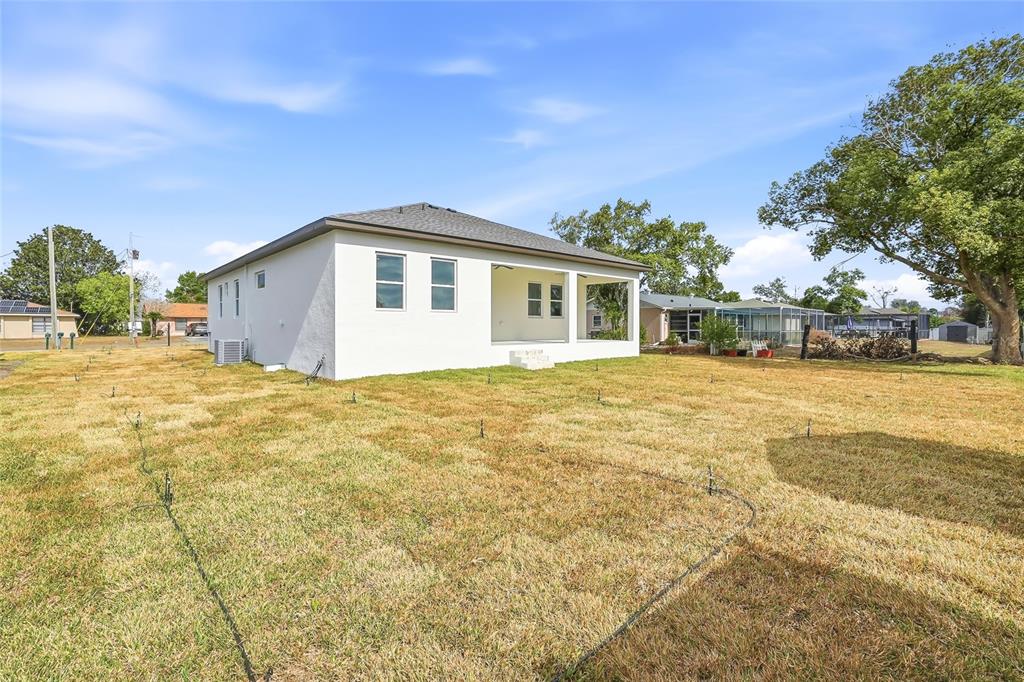 11256 Salters Street Spring Hill, FL 34609 - Photo 37 of 46 a view of a house with yard and sitting area