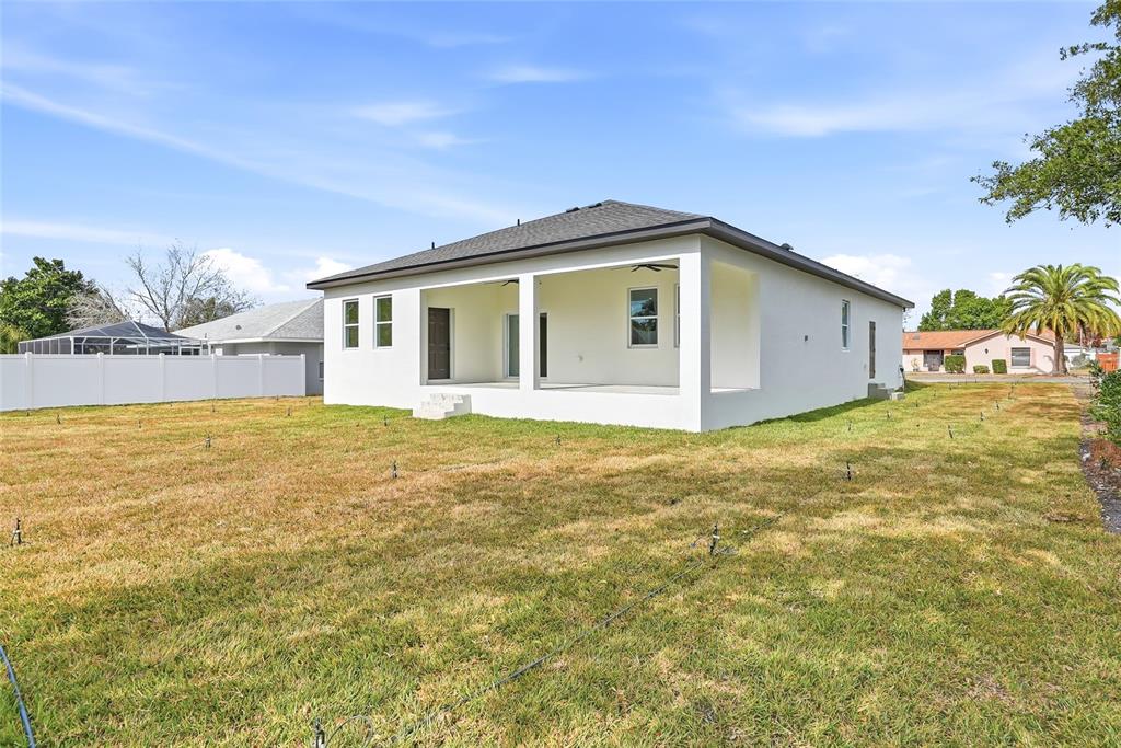 11256 Salters Street Spring Hill, FL 34609 - Photo 38 of 46 a front view of a house with yard