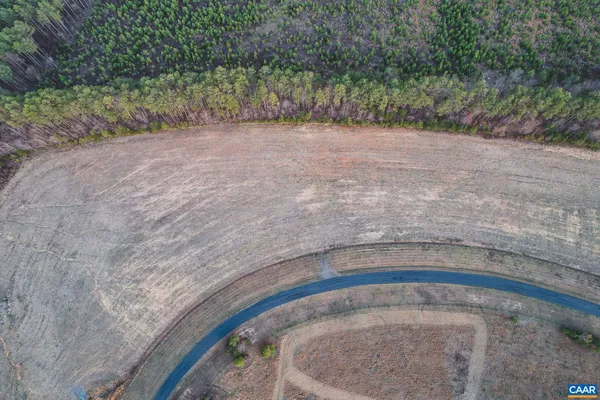 a view of a swimming pool with a yard