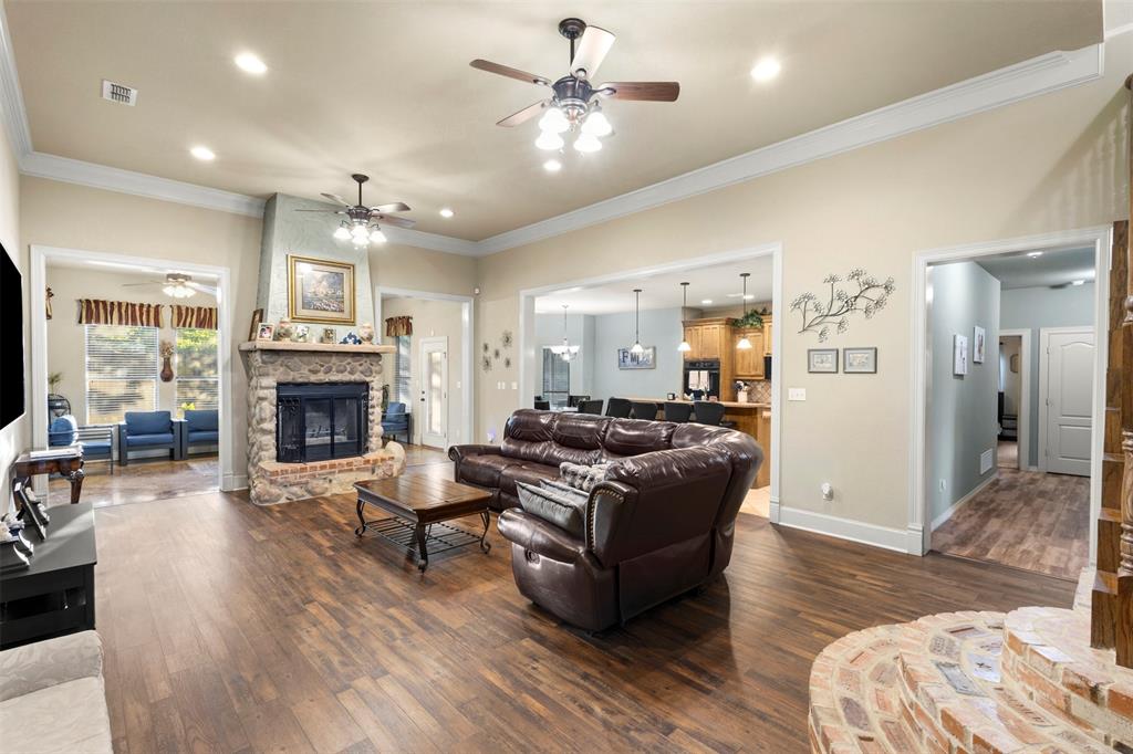 105 Country Ridge Court Red Oak, TX 75154 - Photo 11 of 40 a living room with furniture and a fireplace