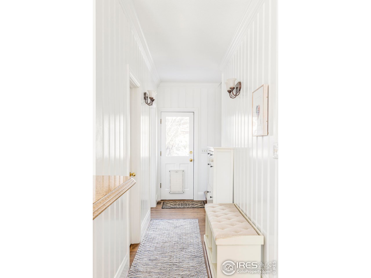 2485 Agate Lane Boulder, CO 80304 - Photo 14 of 38 a view of a hallway with wooden floor