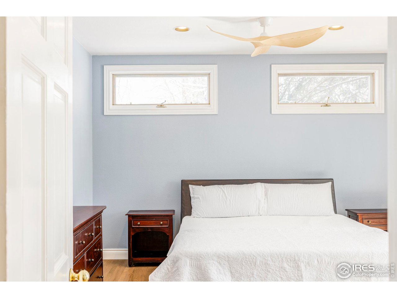 2485 Agate Lane Boulder, CO 80304 - Photo 15 of 38 a bedroom with a bed and a night stand