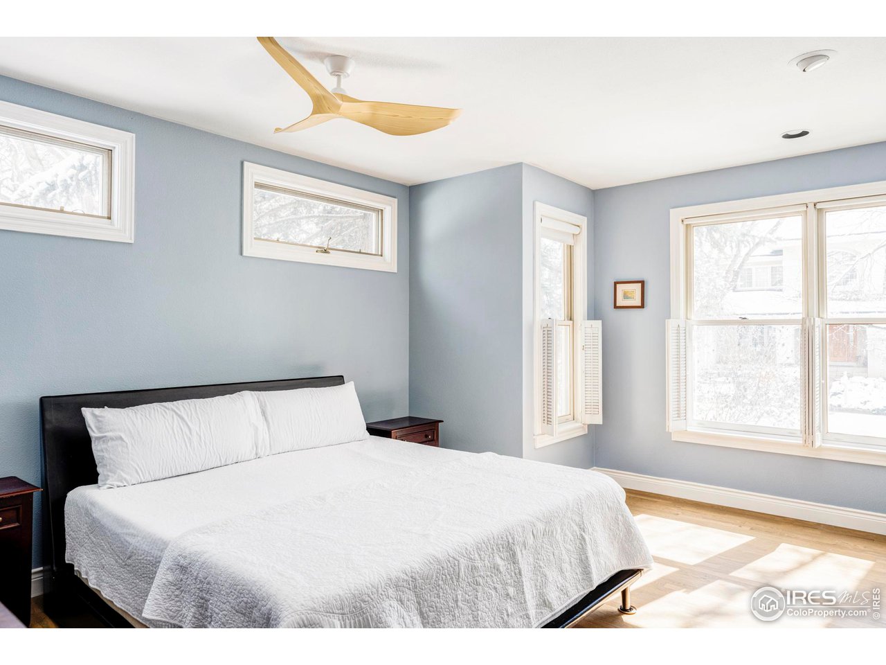 2485 Agate Lane Boulder, CO 80304 - Photo 16 of 38 a bedroom with a large bed and a window