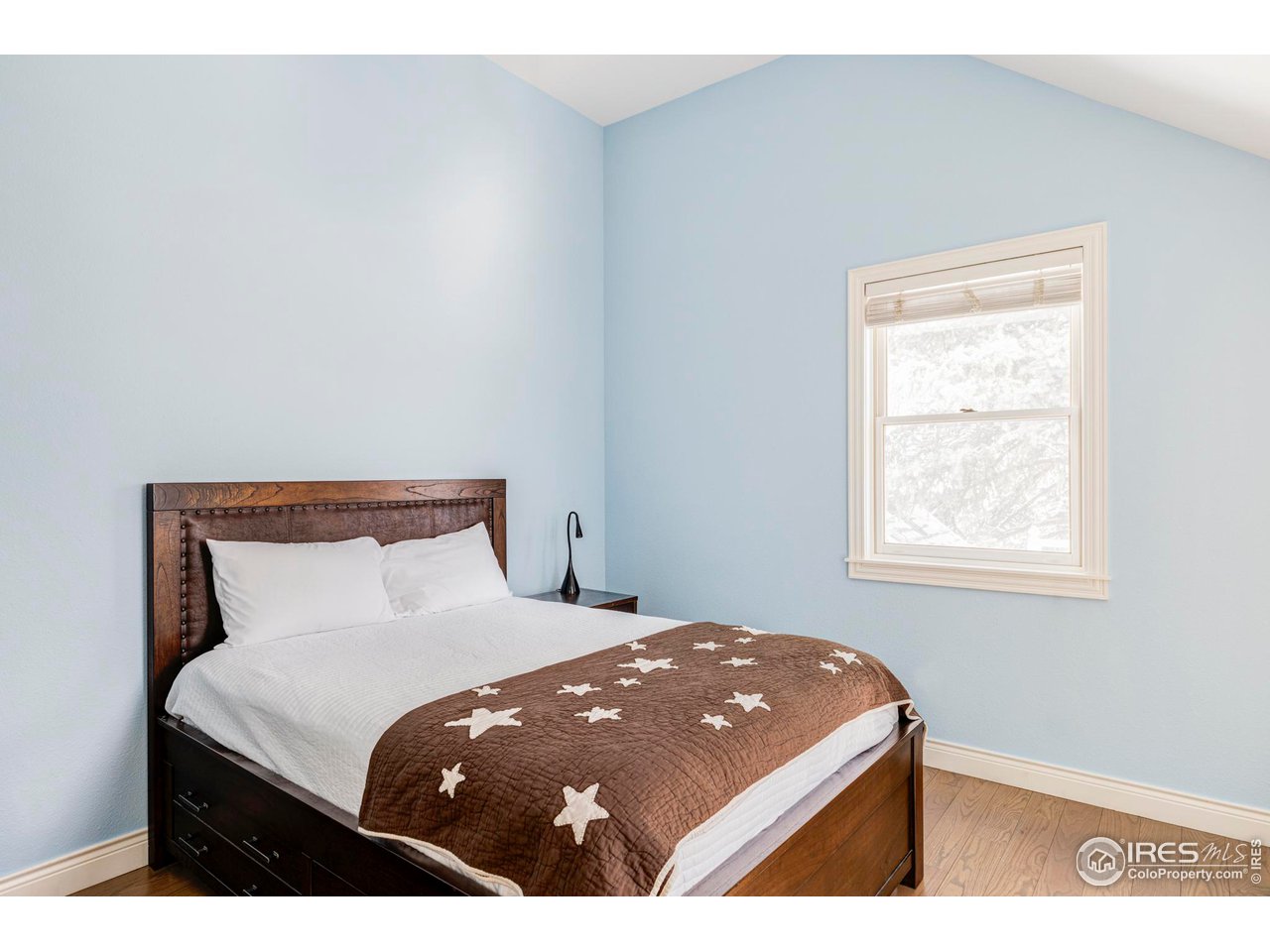 2485 Agate Lane Boulder, CO 80304 - Photo 28 of 38 a bedroom with a bed and a window