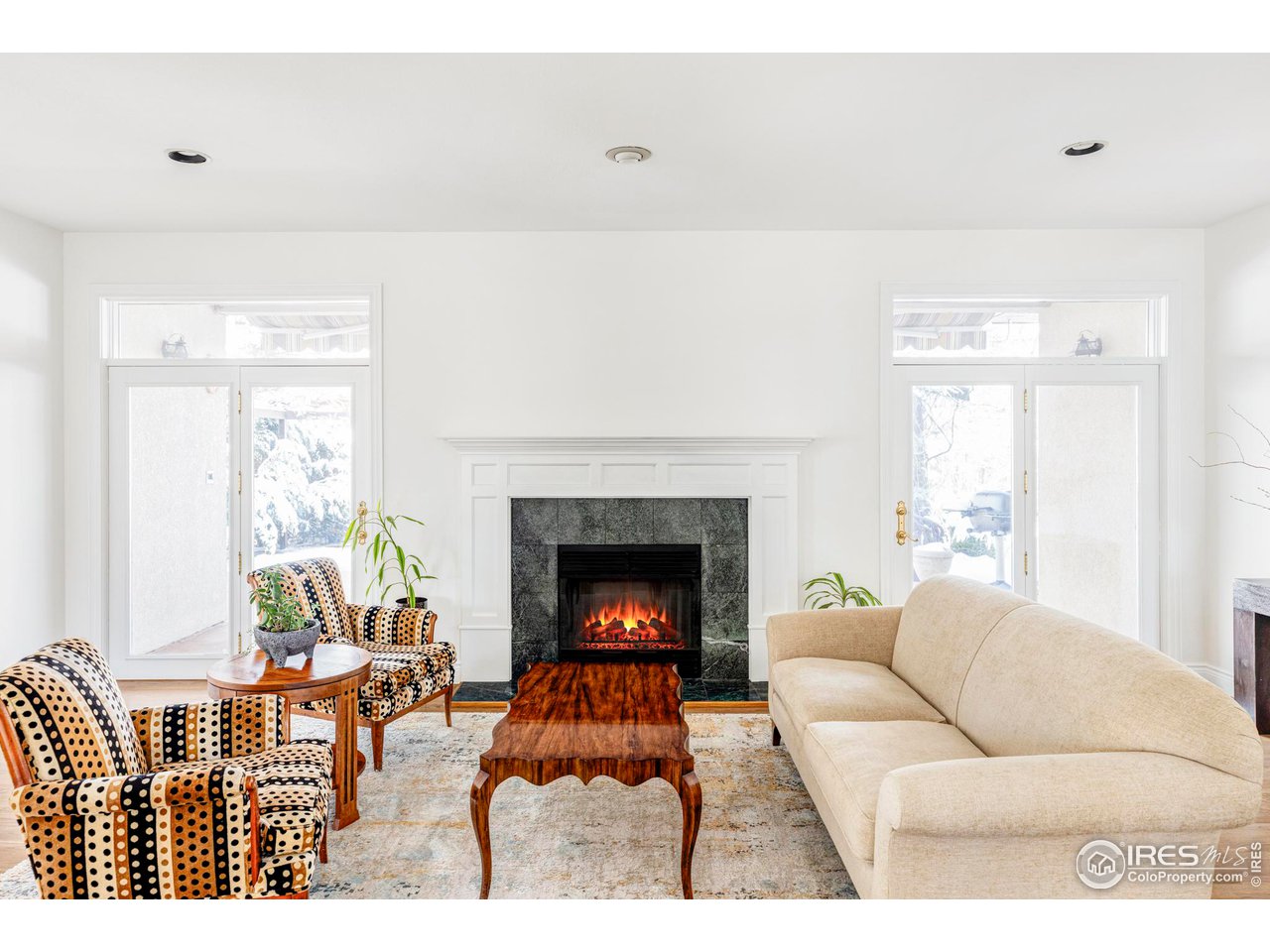 2485 Agate Lane Boulder, CO 80304 - Photo 3 of 38 a living room with furniture and a fireplace