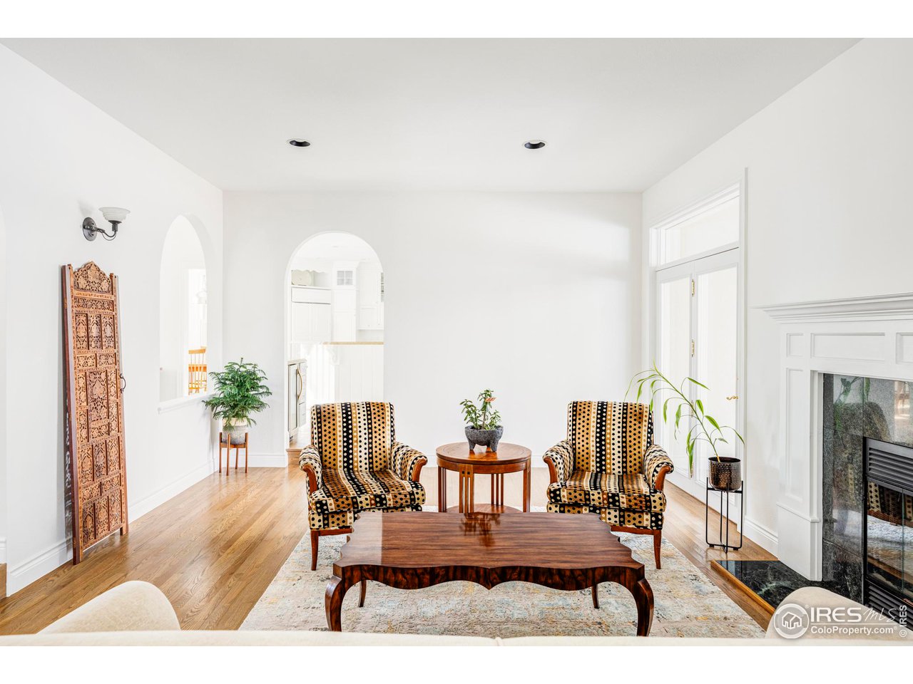2485 Agate Lane Boulder, CO 80304 - Photo 6 of 38 a living room with furniture and a flat screen tv