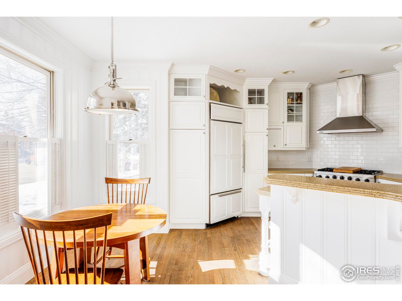 2485 Agate Lane Boulder, CO 80304 - Photo 10 of 38 a kitchen with stainless steel appliances wooden floor and a refrigerator