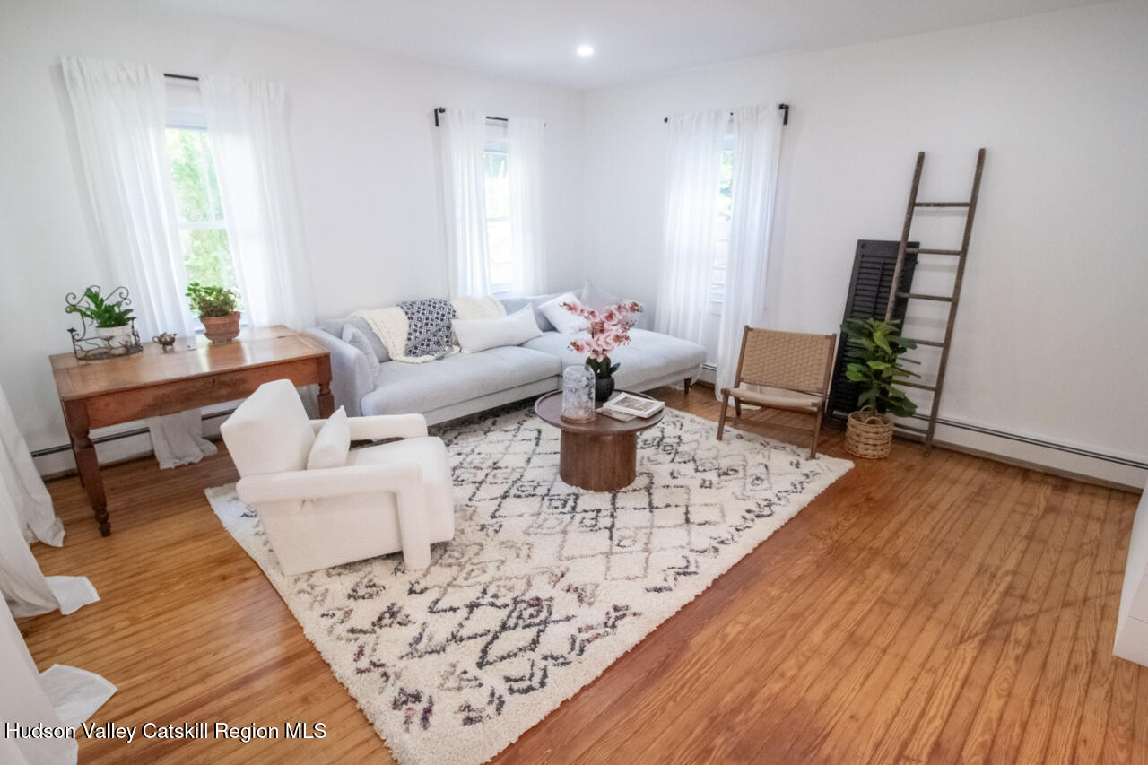 10 State Rte 55 Napanoch, NY 12458 - Photo 12 of 42 a living room with furniture and wooden floor