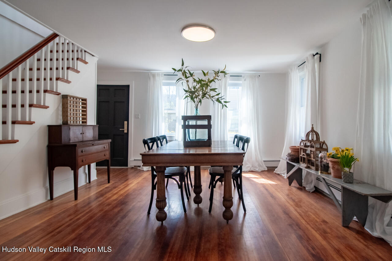 10 State Rte 55 Napanoch, NY 12458 - Photo 15 of 42 a dining room with furniture potted plants and wooden floor