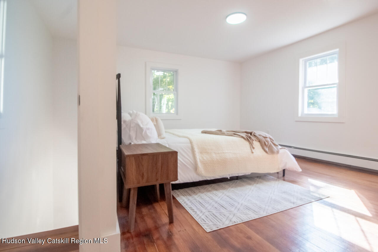 10 State Rte 55 Napanoch, NY 12458 - Photo 32 of 42 a bed sitting in a bedroom next to a window