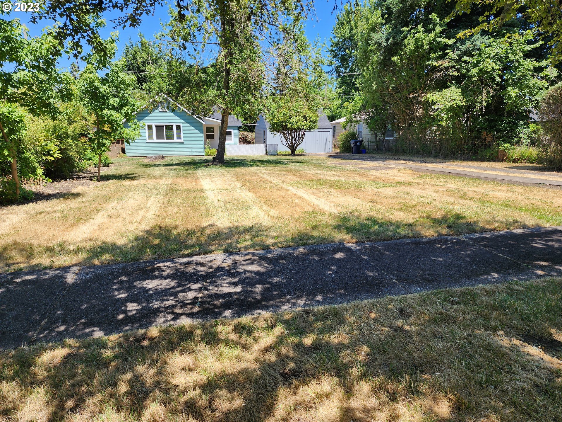 928 F Street Springfield, OR 97477 - Photo 3 of 15 a view of swimming pool of the house with green space