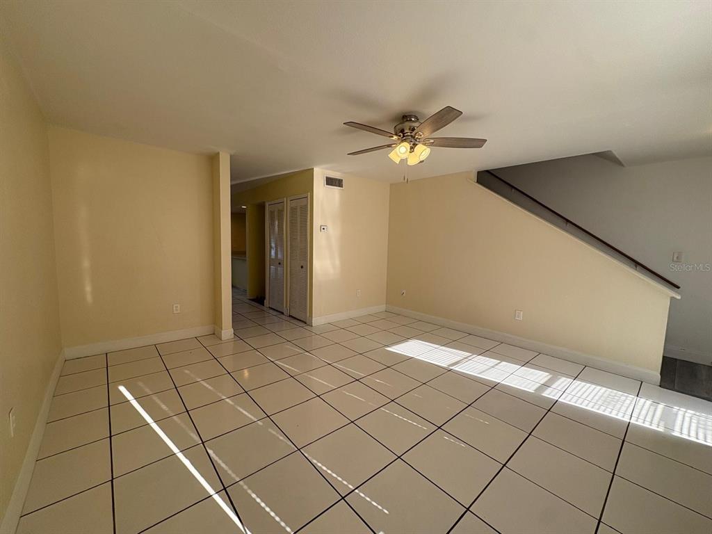 4033 Henley Road, Unit 1707 Orlando, FL 32839 - Photo 26 of 66 a view of an empty room and chandelier fan