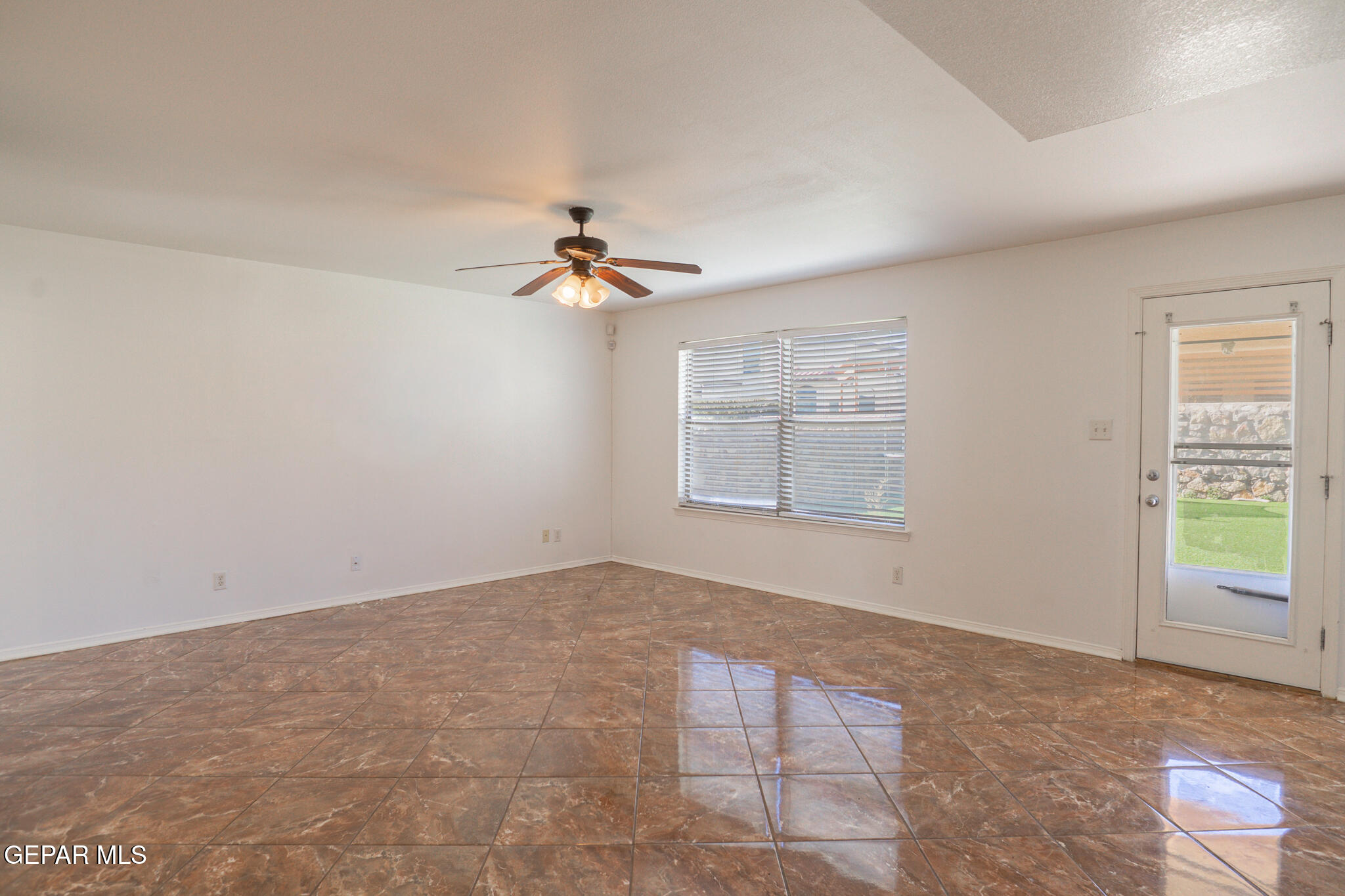 1497 Dunlin Place El Paso, TX 79928 - Photo 13 of 38 a view of an empty room with windows