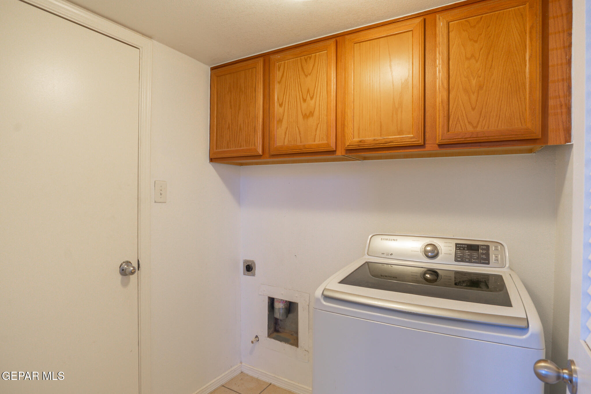 1497 Dunlin Place El Paso, TX 79928 - Photo 18 of 38 a white stove top oven sitting inside of a kitchen
